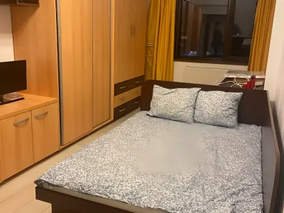 dormitor cu pat apartament de inchiriere Popești Leordeni Ilfov